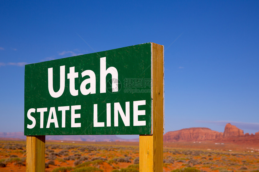 犹他州与亚利桑那州线之间的公路标志招牌国家天空地标沙漠干旱旅行信号公园砂岩图片