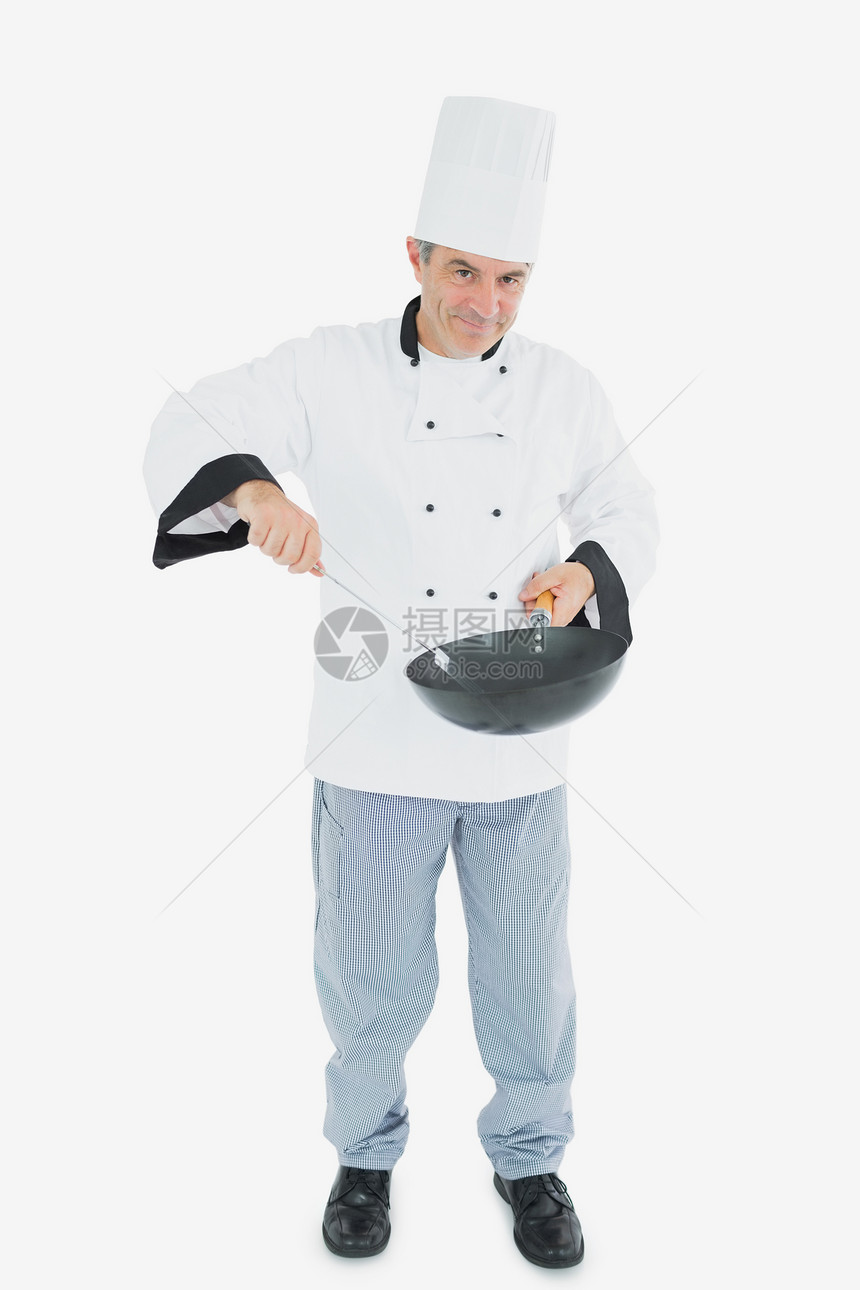 自信的厨师烹饪食品图片