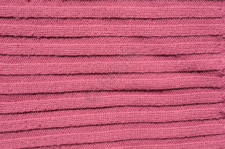 编织结构粉色手工纤维条纹毛衣织物背景图片