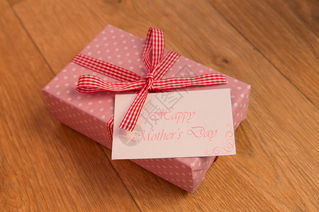 粉粉包装的礼物和母亲日卡背景图片