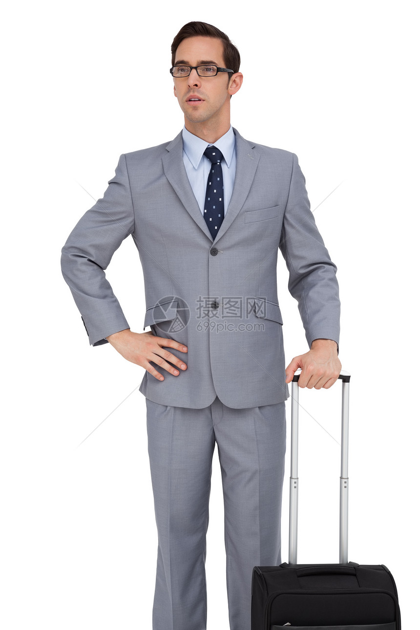 认真的生意人拿着行李在等眼镜商务领带公司旅行人士商业衬衫男人男性图片