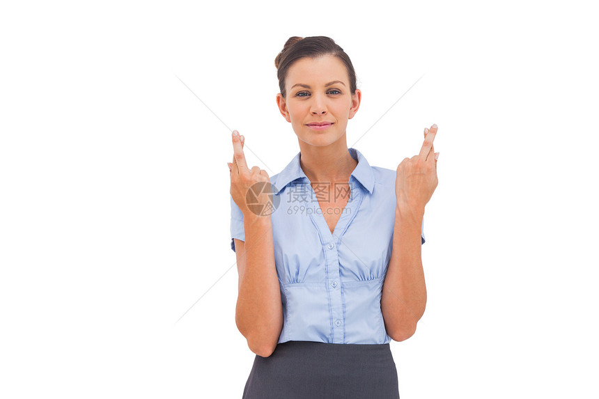微笑的女商务人士用手指交叉图片
