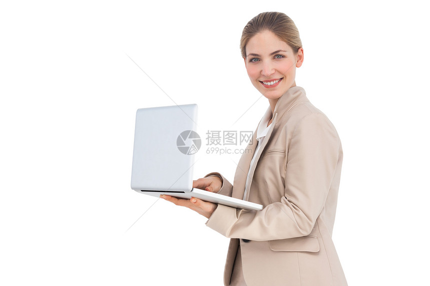 用笔记本电脑打笑女商务人士商务套装夹克商业微笑技术女士女性人士快乐图片