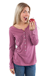 年轻女人准备吃苹果背景图片