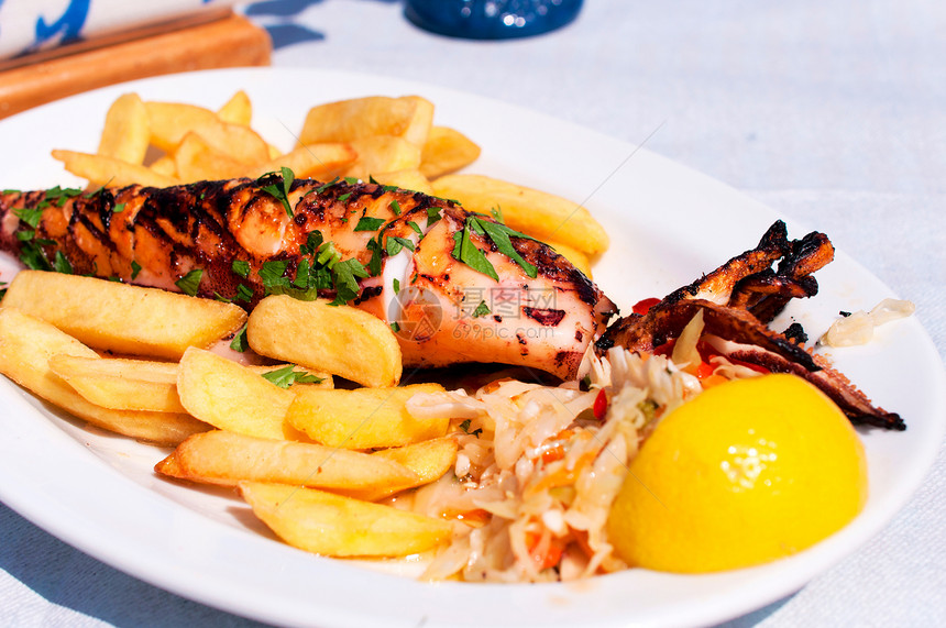 装填的鱿鱼餐厅菜单柠檬乌贼海鲜食物香料海事午餐盘子图片