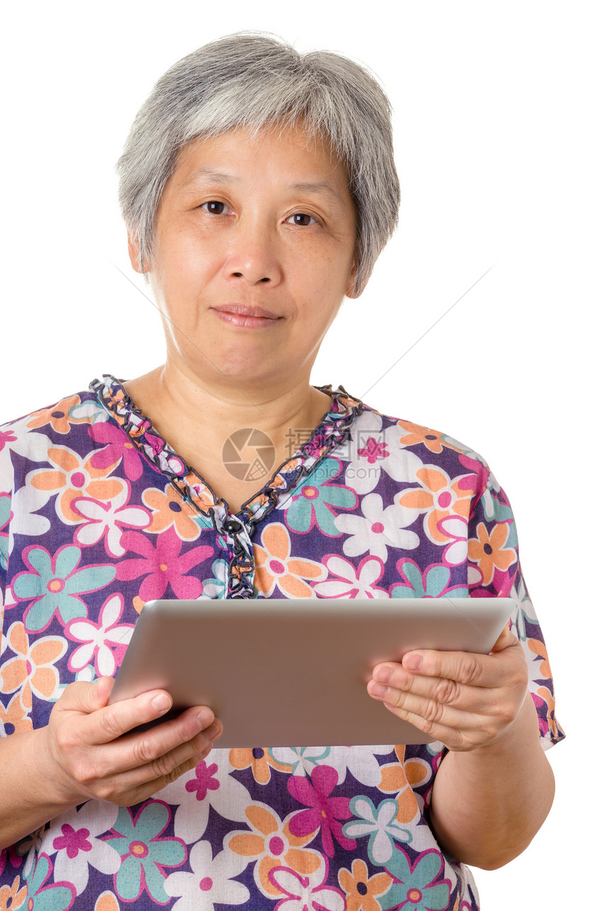 亚洲老年人带数字平板电脑图片