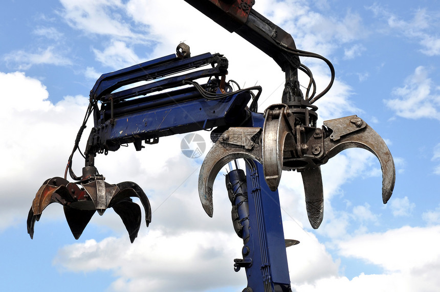 水力爪鹤天空废料工业废料场工具手臂起重机蓝色金属工作图片