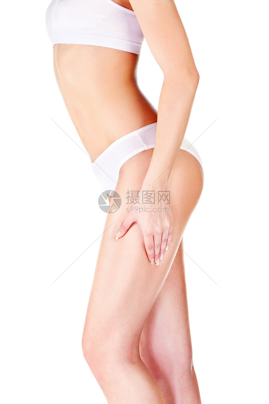 妇女为皮肤折叠测试而捏断腿女士身体内衣女性橘皮组织图片