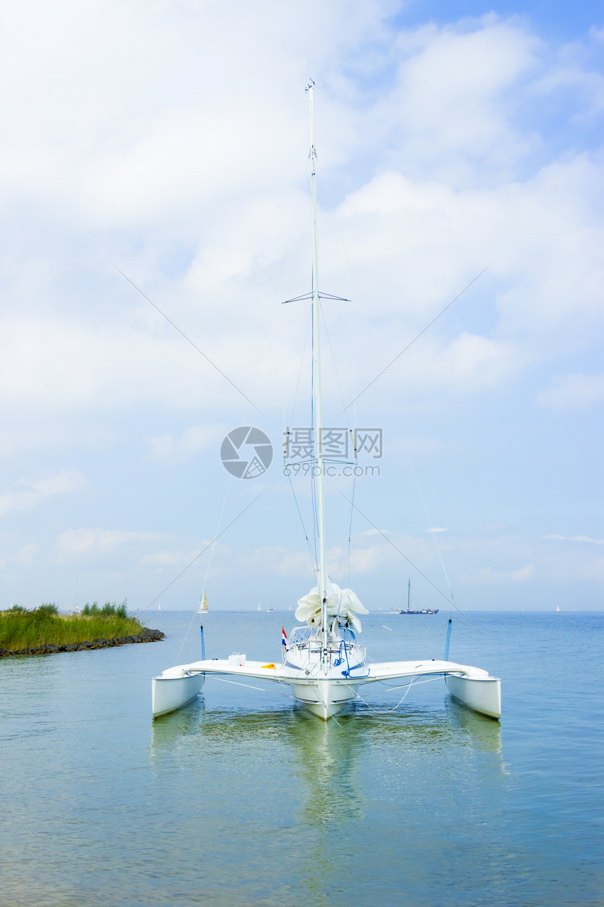 通往灯塔的道路 荷兰Marken海景桅杆海浪营销海岸假期晴天市场蓝色蓝景图片