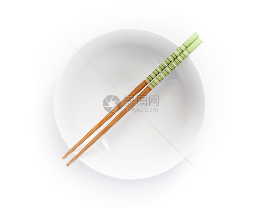 空碗中的筷子 在白色背景上被孤立绿色餐具图片