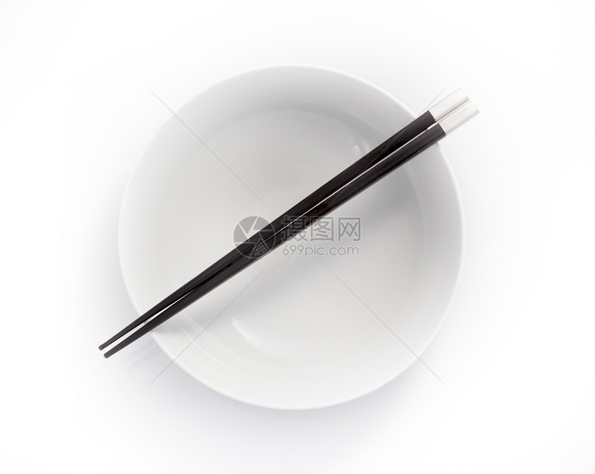 空碗中的筷子 在白色背景上被孤立餐具图片