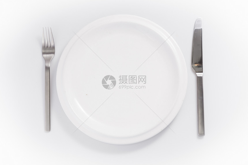 在白色背景上隔离的餐具和瓷器圆形刀叉盘子刀具图片