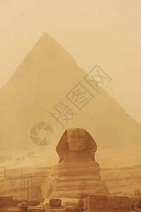 人面狮身沙暴中卡夫雷的斯芬克斯和金字塔 开罗考古学法老地标大篷车人面沙漠纪念碑狮身风暴骆驼背景