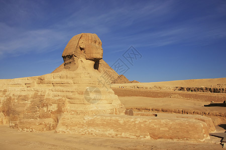 哈夫拉斯芬克斯 开罗人面蓝色骆驼金字塔异位素石头风景风暴考古学狮身背景