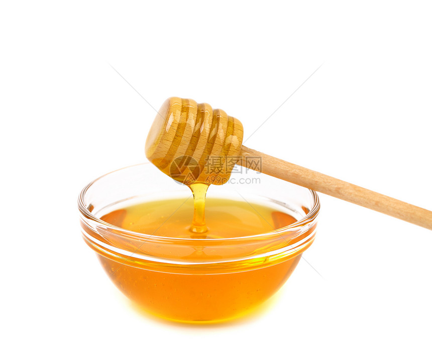 蜂蜜从木制花瓶中滴水食物黄色液体圆形棍棒流动白色用具营养图片