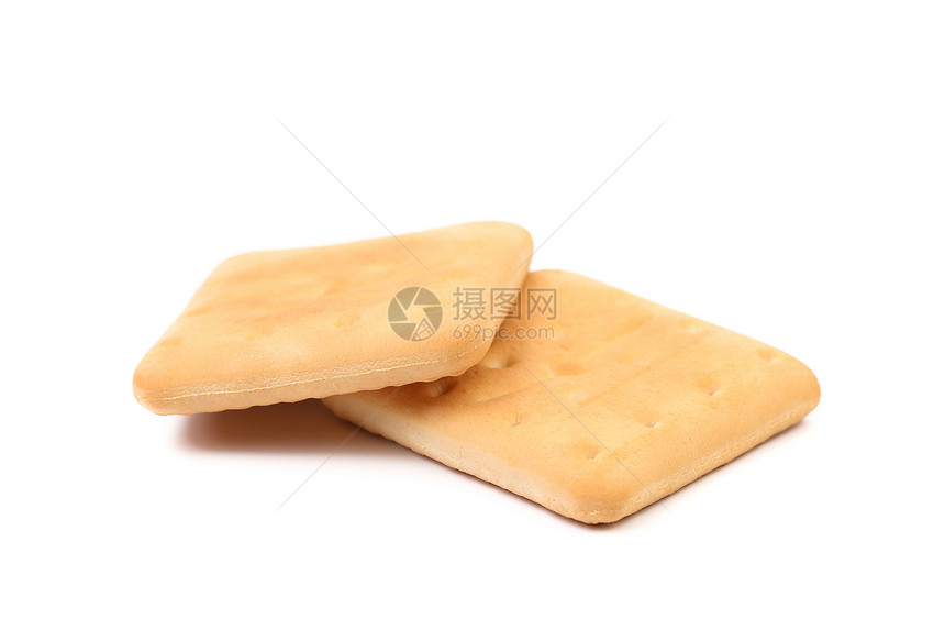 孤立在白色上的盐碱苏打饼干早餐宏观正方形面包饮食饼干盐渍黄色长方形小麦图片