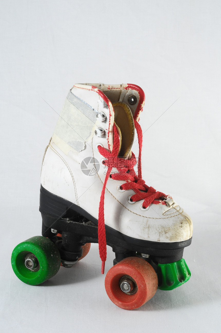 消耗的滚式滑板轮子孩子孩子们靴子车轮鞋带皮革旱冰古董溜冰者图片