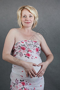 怀着小肚子的美丽的怀孕女孕妇女性婴儿快乐生活女孩母性微笑腹部女士妈妈背景