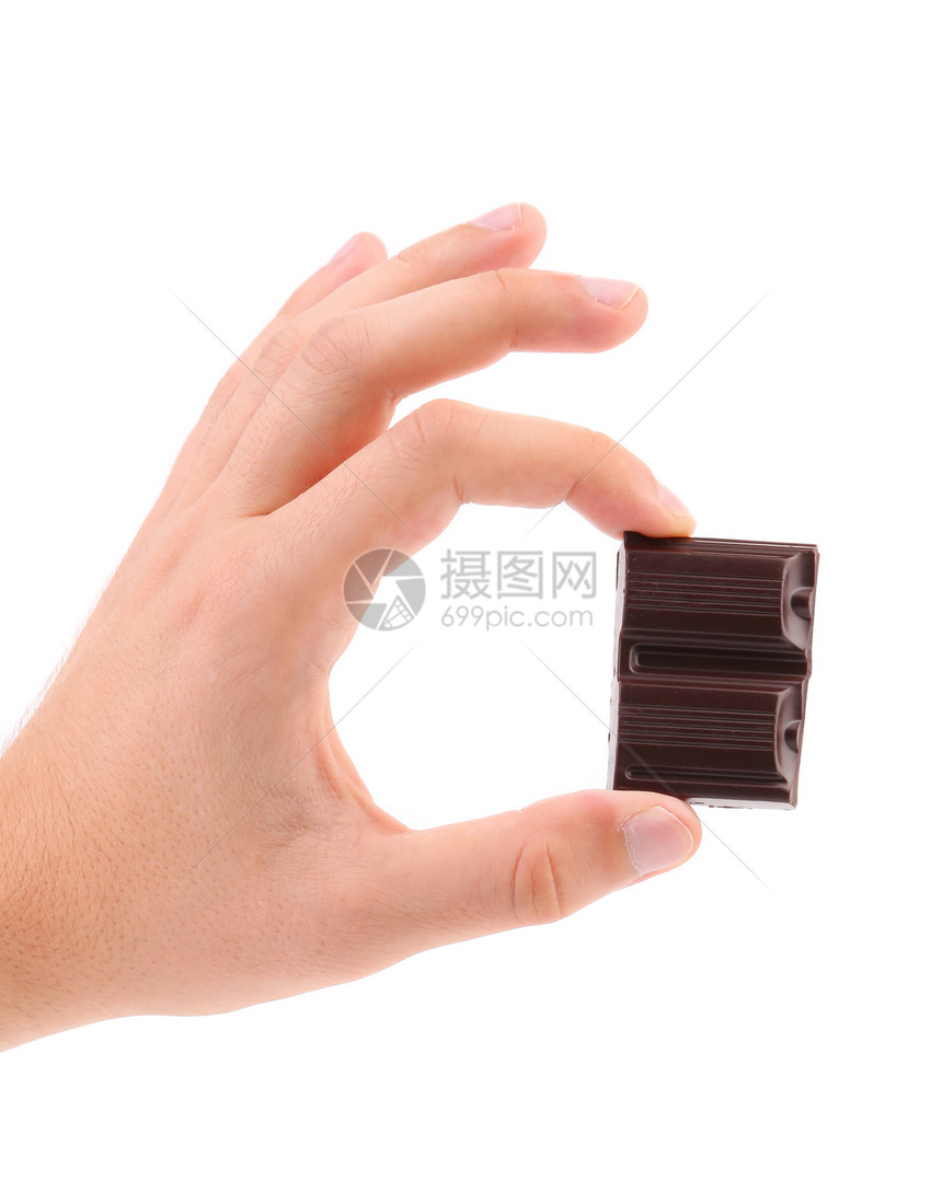手握着两块巧克力美食糖果食物饮食工作室可可营养薄片咖啡店牛奶图片