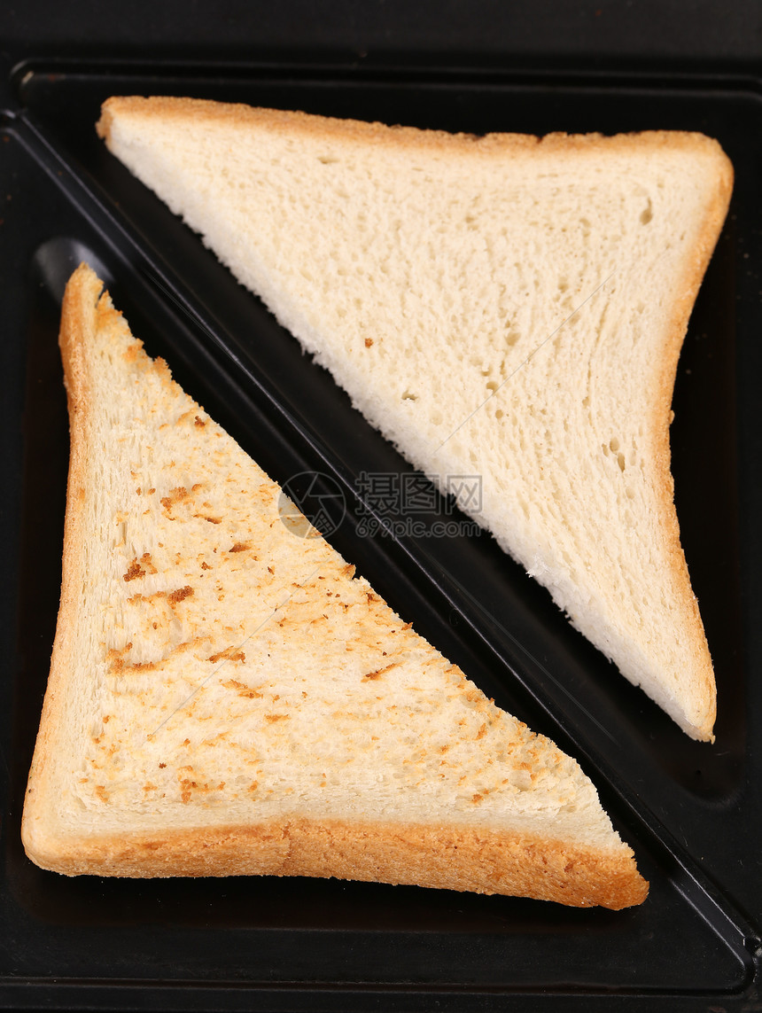 白面包切片早餐面粉脆皮工作室黑色白色批量碳水粮食面包图片