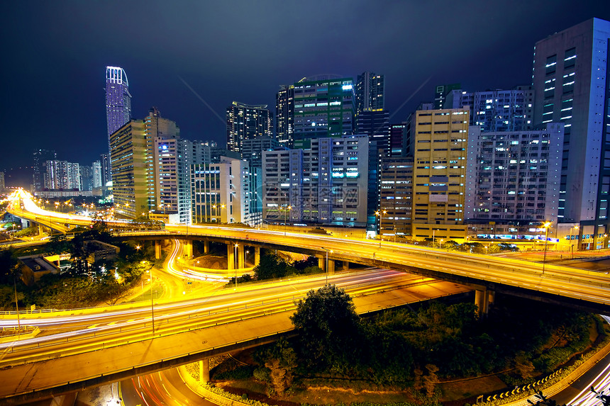 晚上在香港的商务区运输建筑摩天大楼场景日落速度蓝色迂回立交桥戏剧性图片