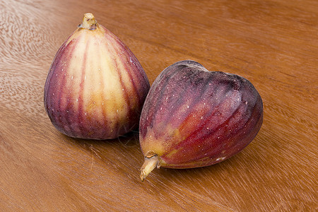 图果水果木头市场种子宏观紫色热带红色绿色棕色背景图片
