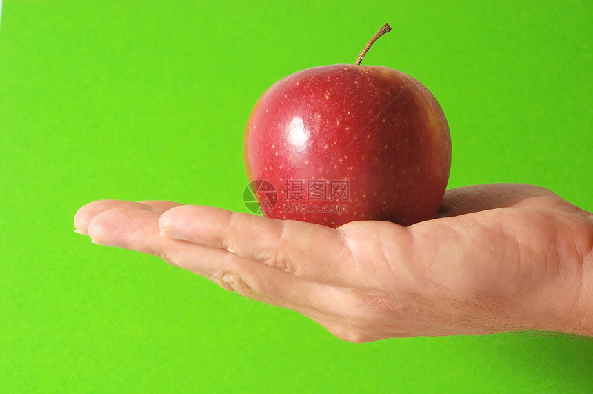 手头上的苹果药品概念饮食水果食物采摘图片