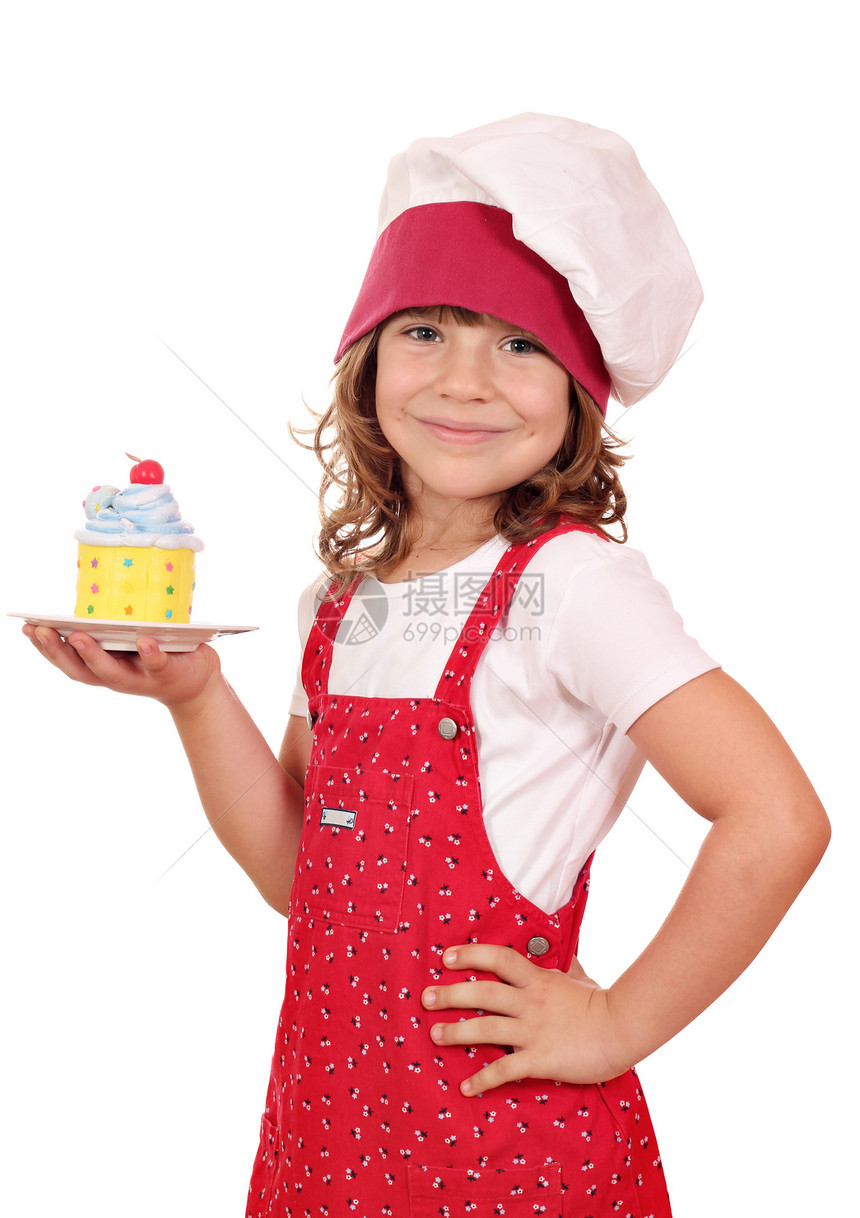 快乐的小女孩用甜甜多彩蛋糕做饭图片