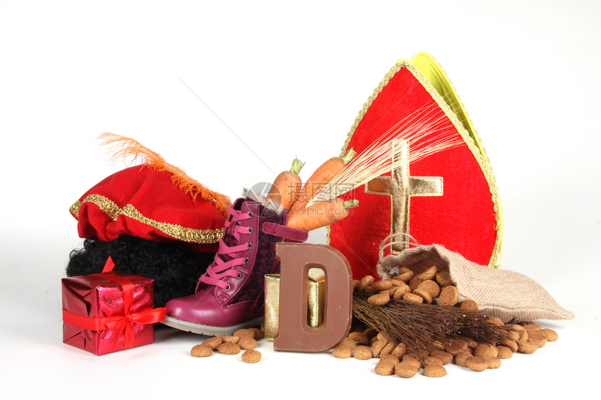 为Sinterklaas夜铺鞋仪式糖果孩子萝卜饼干坚果礼物展示缩写羽毛图片