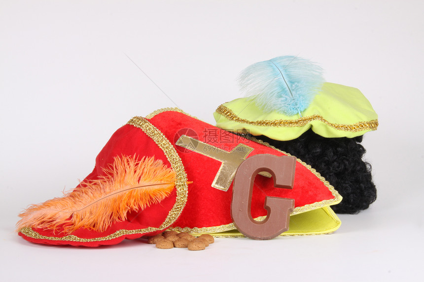 为Sinterklaas夜铺鞋字母饼干礼物卷曲孩子们缩写胡椒帽子羽毛萝卜图片