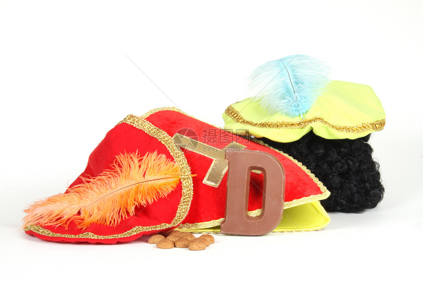 为Sinterklaas夜铺鞋字母羽毛坚果卷曲胡椒礼物展示萝卜头发糖果图片