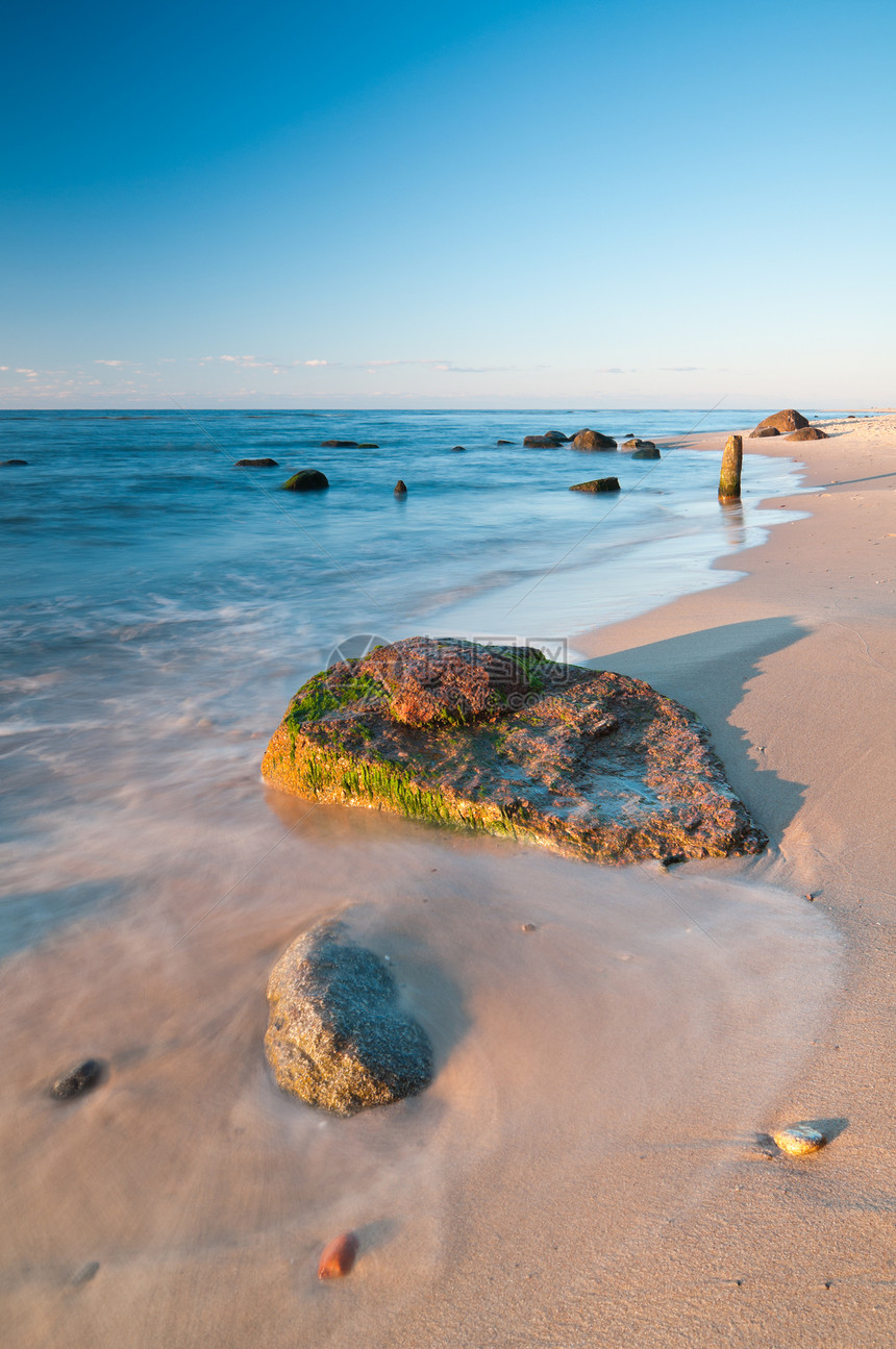 海海岸石头海洋晴天太阳黄色天空蓝色吸引力假期海岸线图片