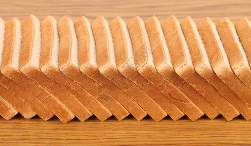 切片小麦面包行背景图片