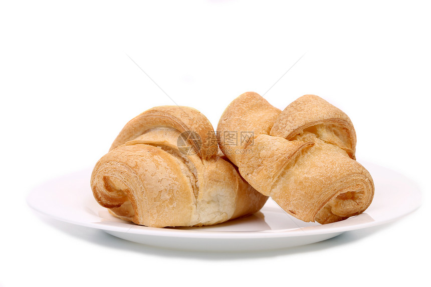 白色盘子上的新鲜羊角面包棕色食物小吃黄油糕点粉状脆皮面团甜点包子图片