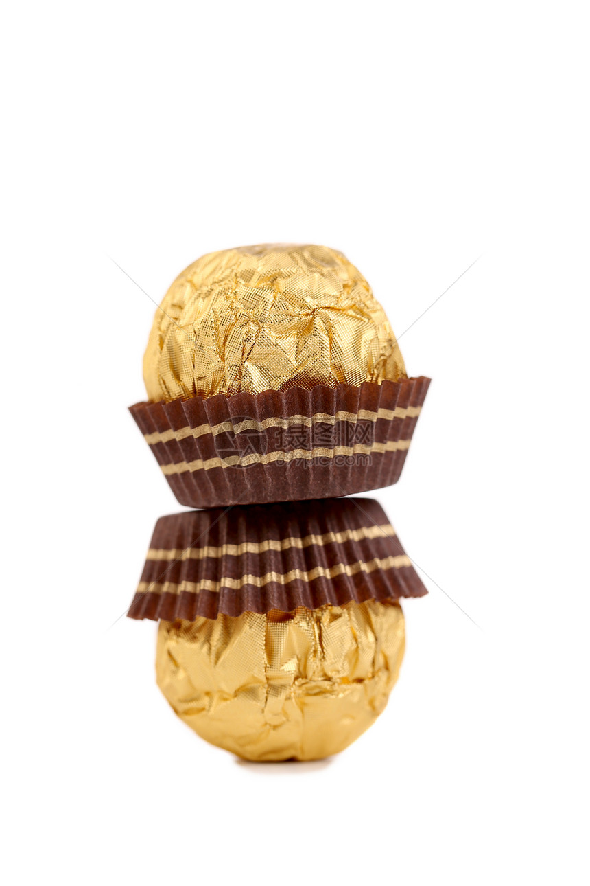 堆满的金巧克力包甜品赌注糕点白色糖果食物金子飞碟甜点巧克力图片