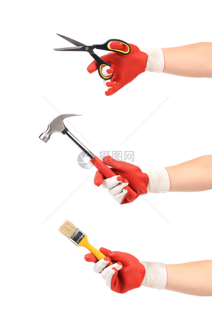 手握锤锤剪刀和油漆刷图片