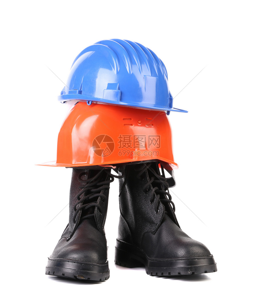 坚硬的帽子和工作靴子个人塑料黑色防护衣服头盔齿轮装备工具预防图片
