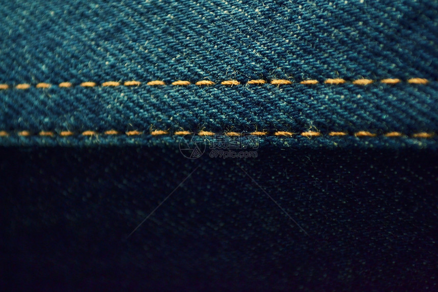 德尼姆布料的背景黑色宏观面料接缝棉布织物牛仔裤纺织品蓝色空白图片
