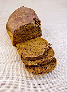 粗布袋装的Rye自制面包背景图片