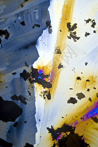 分极光中的烟尘颗粒和微晶晶体材料光谱矿物质魔法摄影水晶纳米照片显微显微镜背景图片