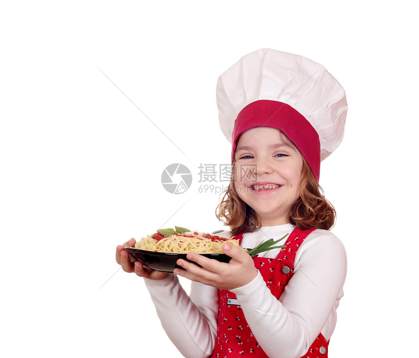 快乐的小女孩烹饪 小女孩做饭与意大利面白帽子美食小吃青年孩子童年厨师女孩女性乐趣图片