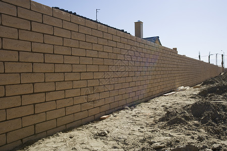 一座未完工建筑中的瓦砖墙背景图片