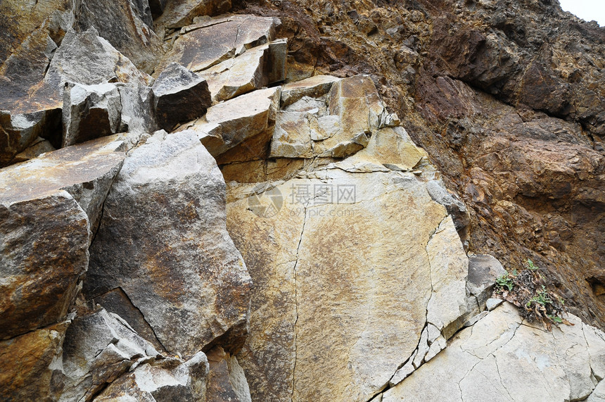 火山岩黑色纹理石头材料宏观花岗岩建筑学火山矿物棕色图片