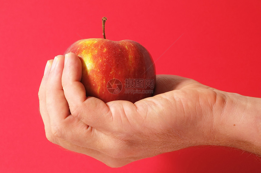 手头上的苹果药品食物饮食水果采摘图片