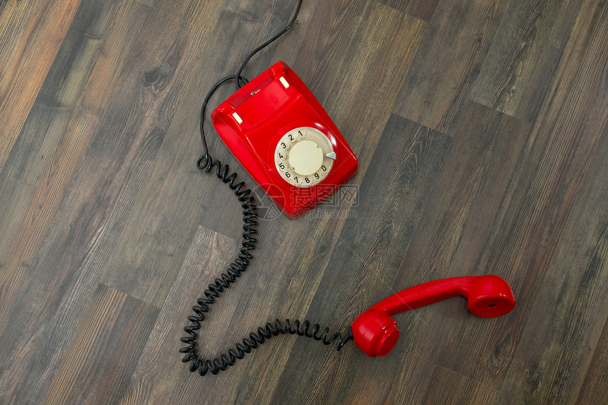 红电话木地板地面说谎电讯器具技术红色拨号房间塑料图片