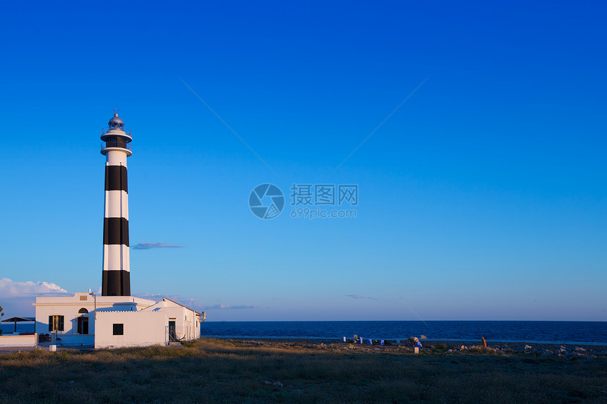 西南角的灯塔海洋假期岛屿地标信号日落旅行场景导航建筑图片