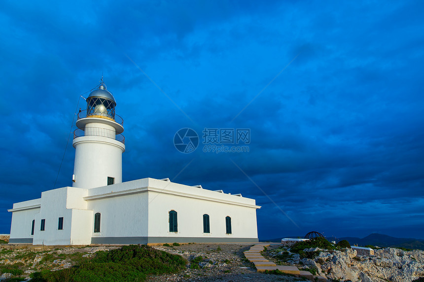 法罗德卡瓦勒里亚灯塔的门诺卡日落信号岩石海岸导航旅行旅游海洋岛屿建筑建筑学图片