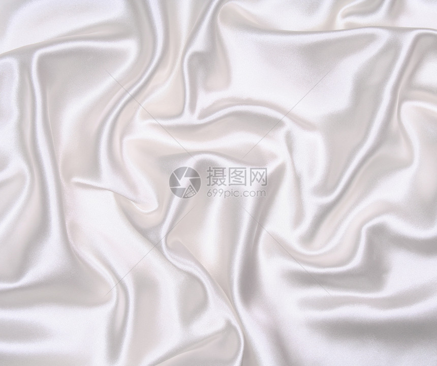 作为婚礼背景的平滑优雅白色丝绸纺织品银色曲线材料涟漪折痕投标织物新娘布料图片