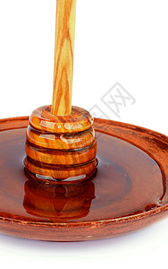 蜂蜜和晚餐生活方式炊具饮食木头食物蜂蜜想法橙子液体概念背景图片