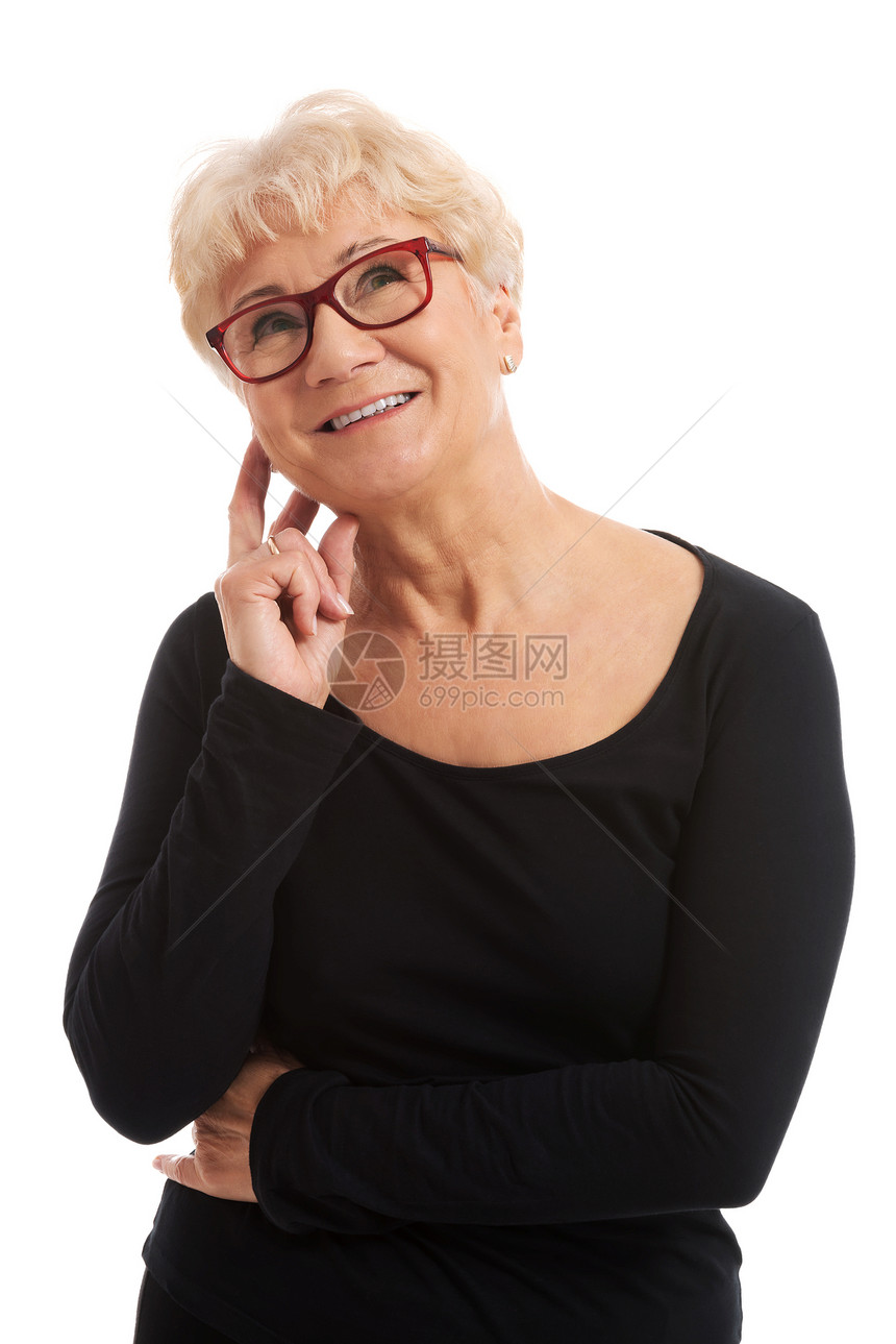戴眼镜的老太婆摸着她的脸老年长老护理化妆品疾病成人皮肤头发祖母女性图片